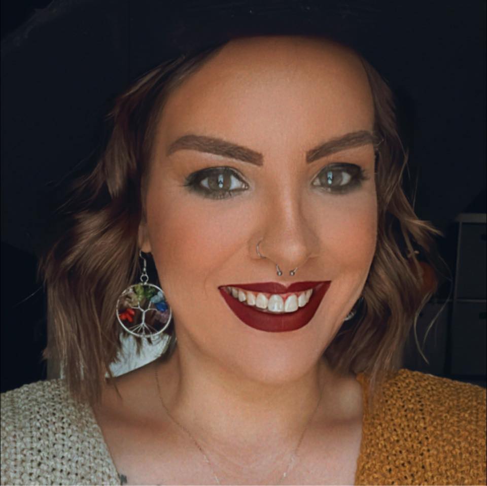 Brea is a white woman in her mid-30's with an olive complexion and green eyes.